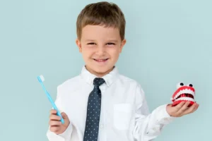 Dentist evaluating a child for teeth grinding